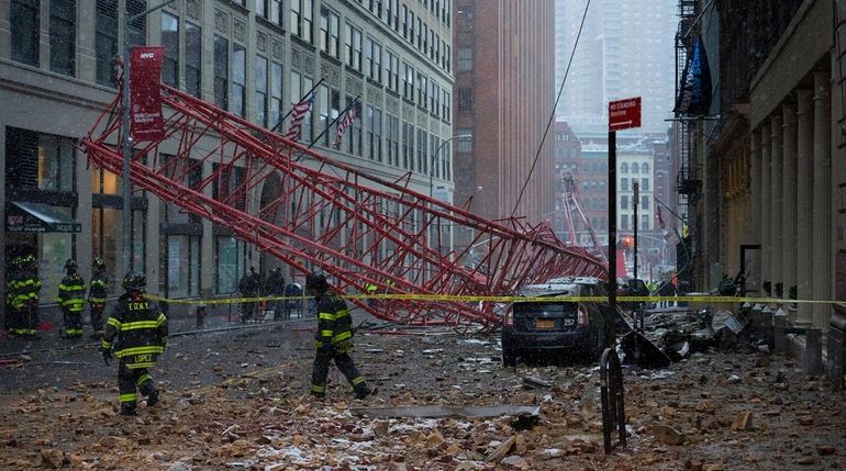 FDNY firefighters at the scene of a crane collapse on...