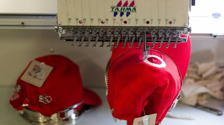 Hats are embroidered at David Peyser Sportswear in Bay Shore...