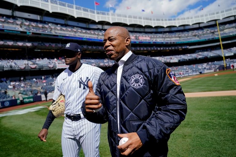 New York, USA. 08th Apr, 2022. Baseball fans line up enter Yankee Stadium  on Yankee opening day 2022, in the Bronx borough of New York City, NY,  April 8, 2022. The Yankee's