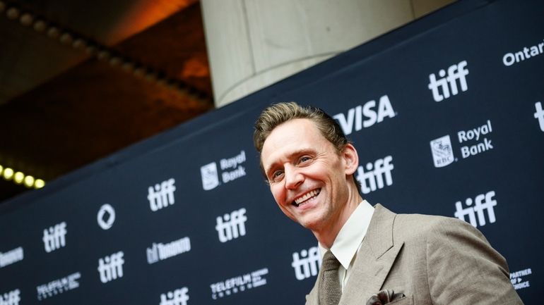 Tom Hiddleston arrives on the red carpet ahead of the...