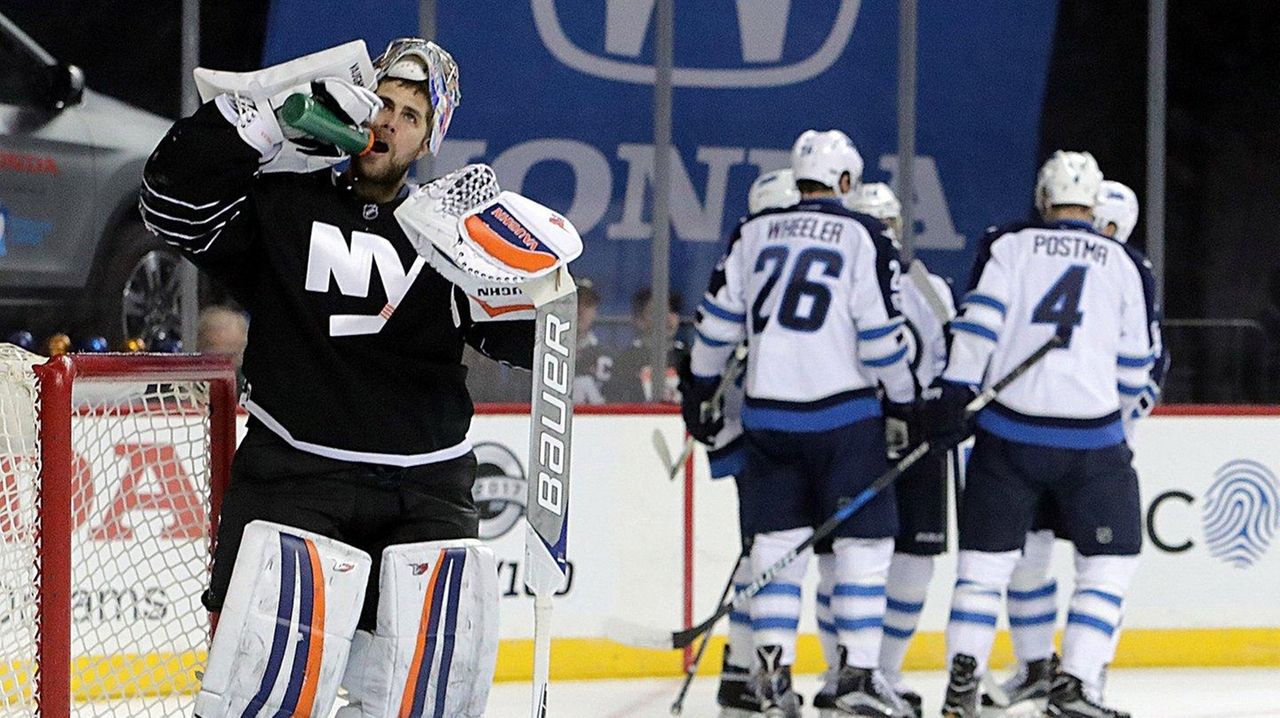 Isles earn first win of season by beating Winnipeg Jets in Brooklyn -  Newsday