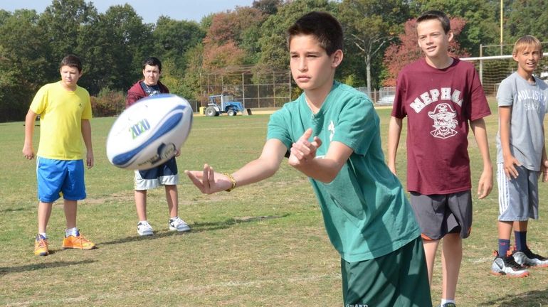 Students at Wellington C. Mepham High School in Bellmore receive...