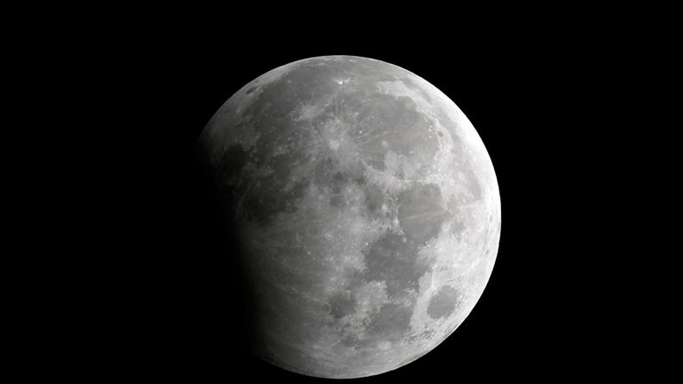 A partial lunar eclipse is seen in Karachi, Pakistan, Oct....