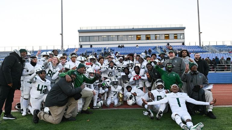 The Holy Trinity championship team poses for a photo during...