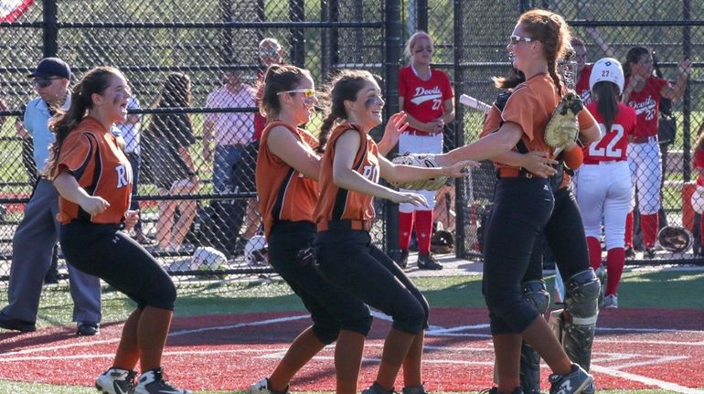 East Rockaway players celebrate after defeating Center Moriches in the Long...