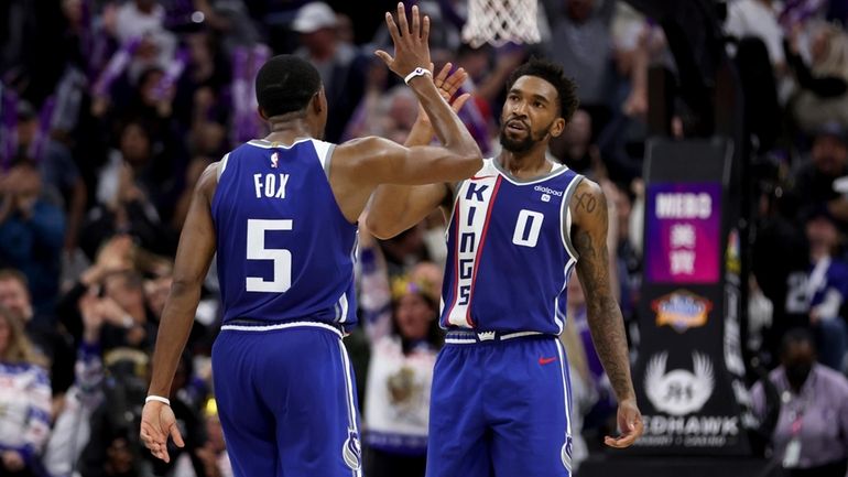 Sacramento Kings guard Malik Monk (0) is congratulated after scoring...