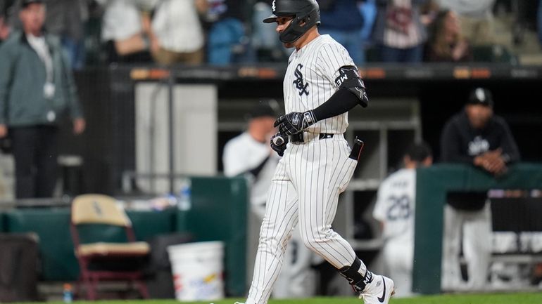 Chicago White Sox's Danny Mendick runs the bases after hitting...