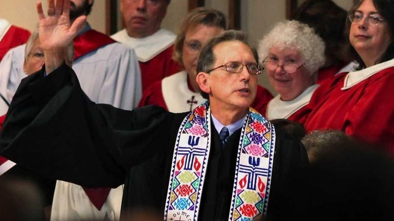 The Rev. Scott Anderson gives the benediction at the end...