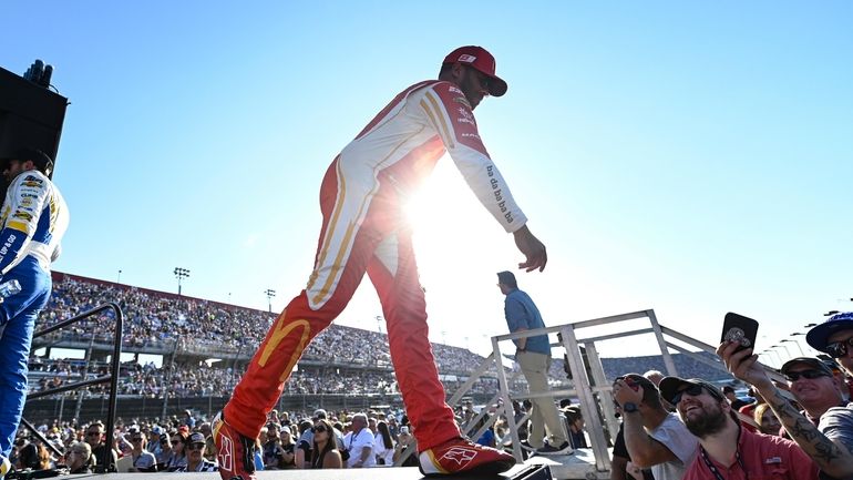 Bubba Wallace greets fans prior to a NASCAR Cup Series...