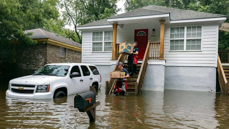 Savannah Fire Advanced Firefighters Ron Strauss, top, and Andrew Stevenson,...