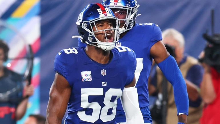 Bobby Okereke of the Giants celebrates after making a defensive...