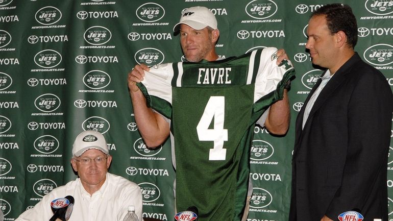 Brett Favre, holding his new jersey, address the media after being traded  to the New York Jets from the Green Bay Packers during a press conference  at Cleveland Browns Stadium in Cleveland