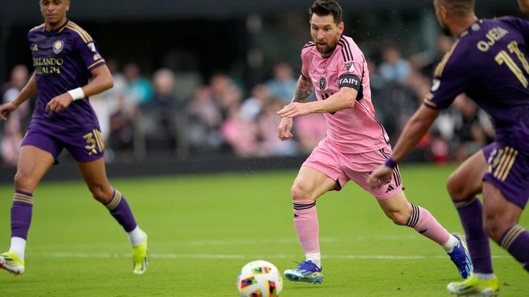 Inter Miami forward Lionel Messi (10) dribbles the ball under...