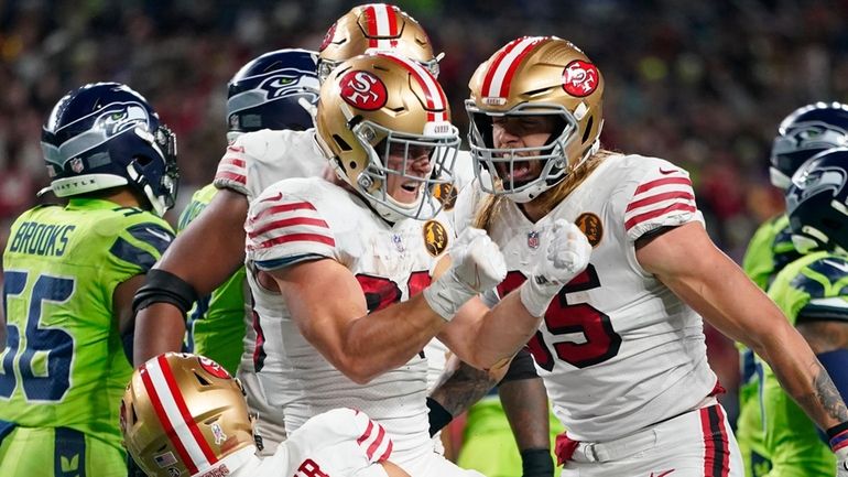 San Francisco 49ers running back Christian McCaffrey (23) reacts after...