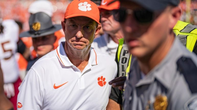 Clemson head coach Dabo Swinney walks off the field after...