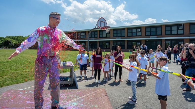 Park View Elementary School Principal Kevin Storch gets spray painted...