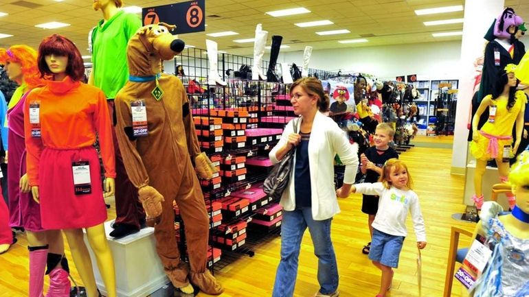 Mary McQuaid of Floral Park shops with her children, Michael,...