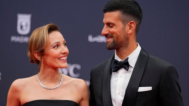 Serbian tennis player Novak Djokovic, right, and Jelena Ristic pose...