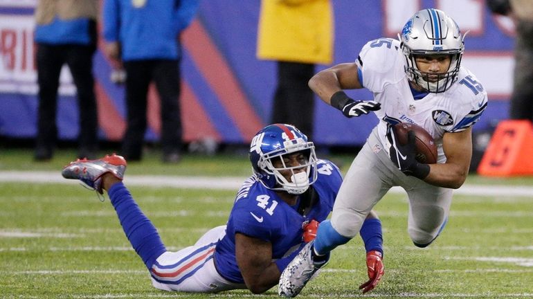 New York Giants cornerback Dominique Rodgers-Cromartie tackles Detroit Lions' Golden...