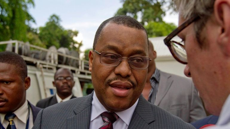 Haiti's then Prime Minister Garry Conille speaks with journalists after...