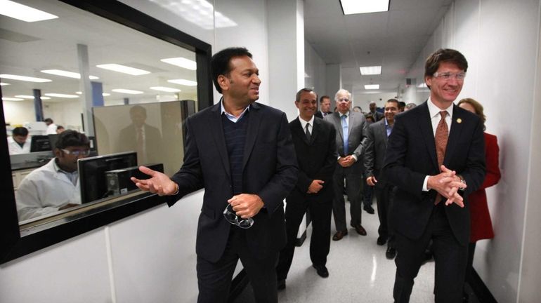 Amneal chief Chintu Patel, left, shows the company’s Yaphank factory...