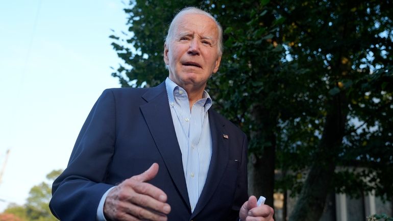 President Joe Biden speaks to reporters outside of St. Edmond's...