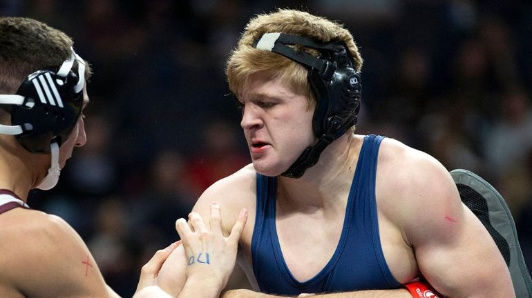 Matt Campo of Mount Sinai wrestles Alec Richards of Corinth...