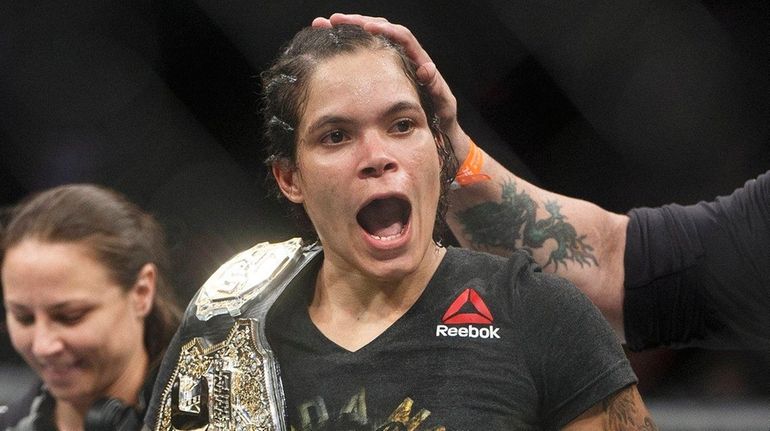 Amanda Nunes celebrates after defeating Valentina Shevchenko at UFC 215...