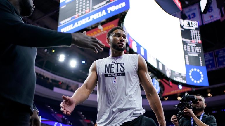 Nets' Ben Simmons walks off the court after warming up...