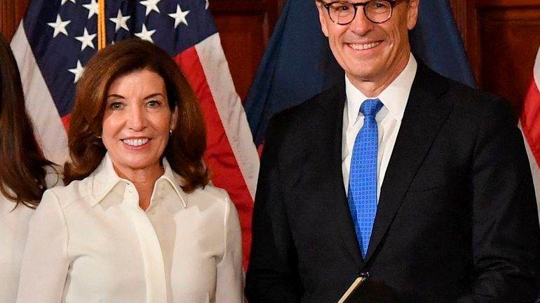 Gov. Kathy Hochul with her husband William Hochul during her swearing...