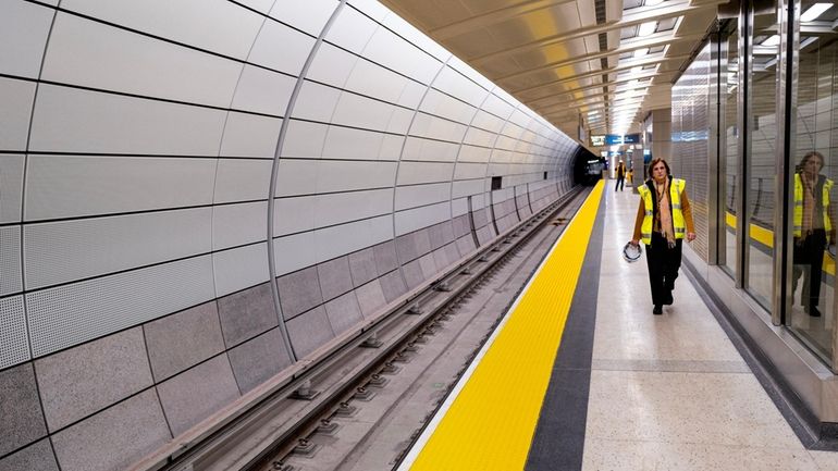 LIRR interim president Catherine Rinaldi walks along one of the...