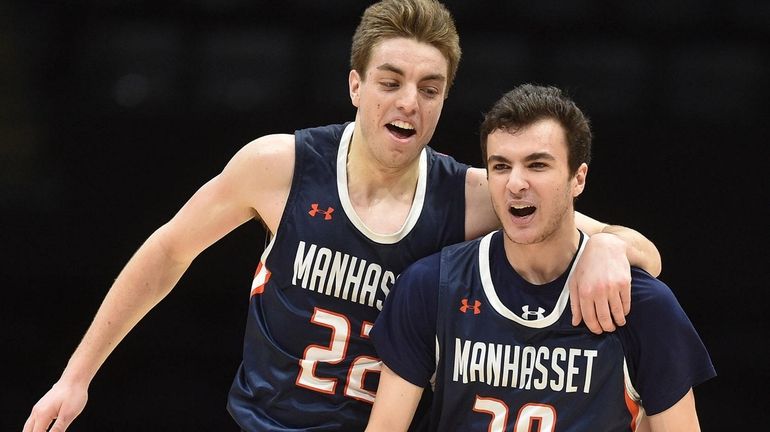 John Mastando #30, right, and Thomas Santella #22 of Manhasset...