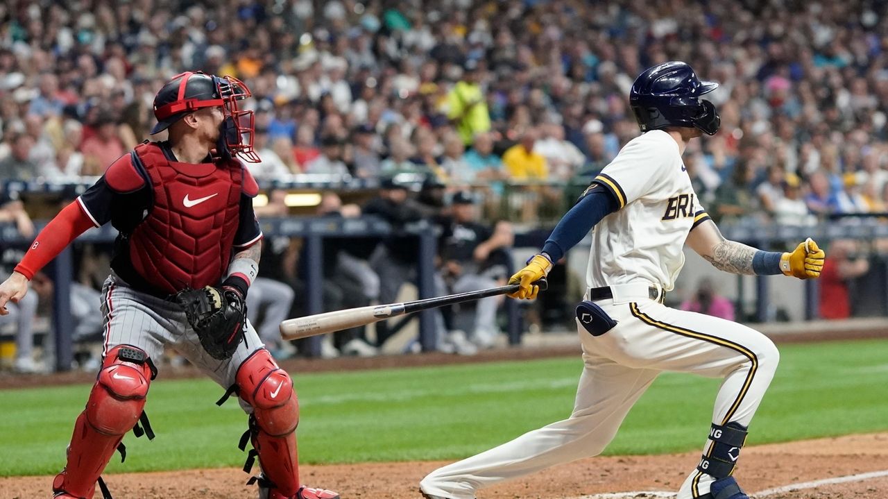 Milwaukee Brewers' Tyrone Taylor watches his three-run double off