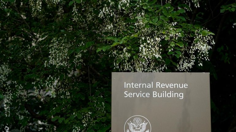 A sign for the Internal Revenue Service building in Washington,...