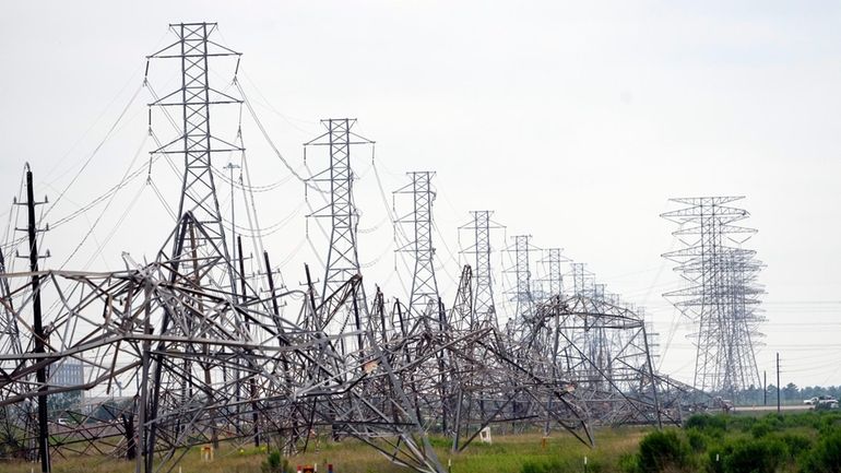 Down power lines are shown in the aftermath of a...