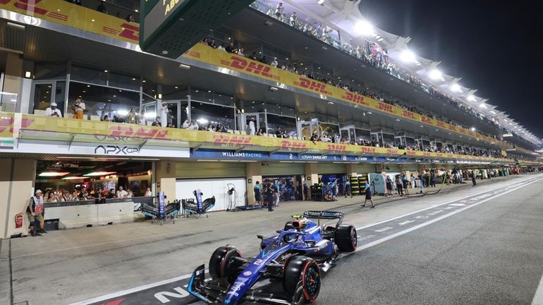 Williams driver Logan Sargeant of the US steers his car...