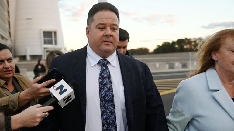 Tully Lovisa of Huntington Station leaves federal court in Central Islip after...