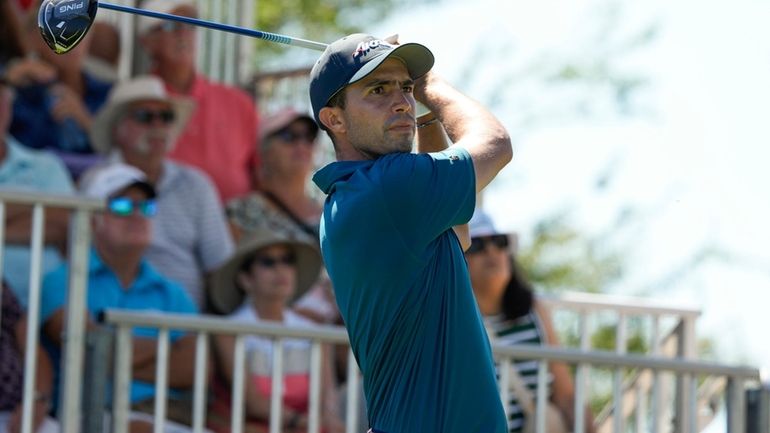 Alvaro Ortiz, of Mexico, watches his tee shot on the...