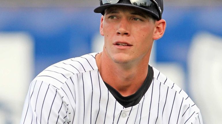 Yankees prospect Peter O'Brien warms up in Trenton on Tuesday,...