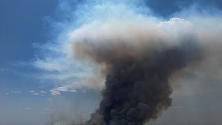 Smoke rises from a fire in the environmentally protected area...