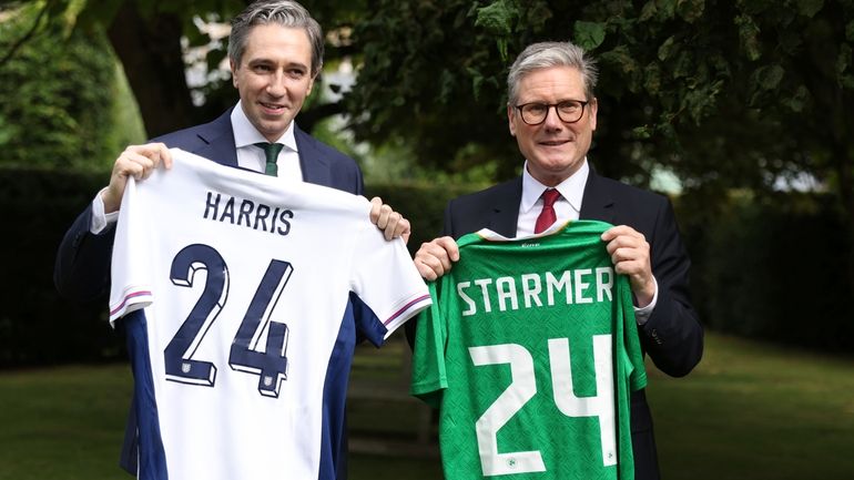 The Prime Minister of Ireland Simon Harris, left, and his...