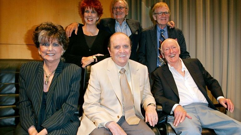 Bob Newhart, center, poses with members of the cast and...