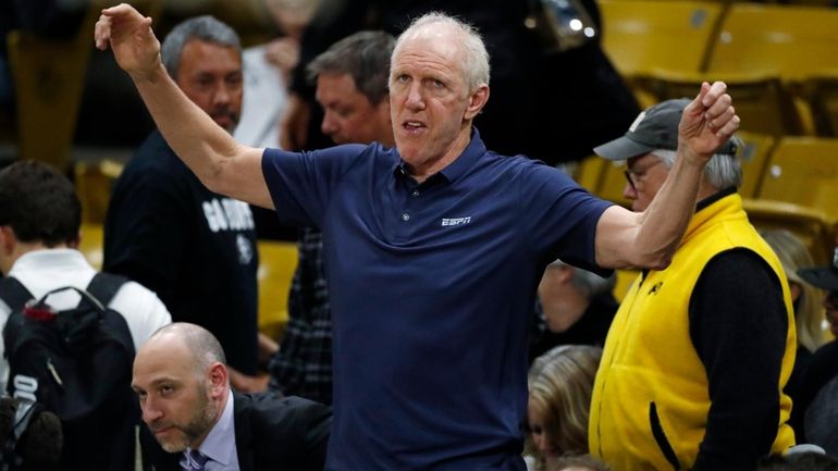 Television analyst Bill Walton stretches before the first half of...