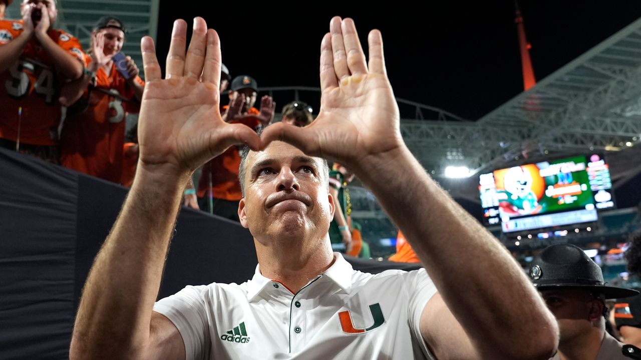 The football alumni are flooding Miami's sidelines. The unbeaten Hurricanes are seeing the benefits