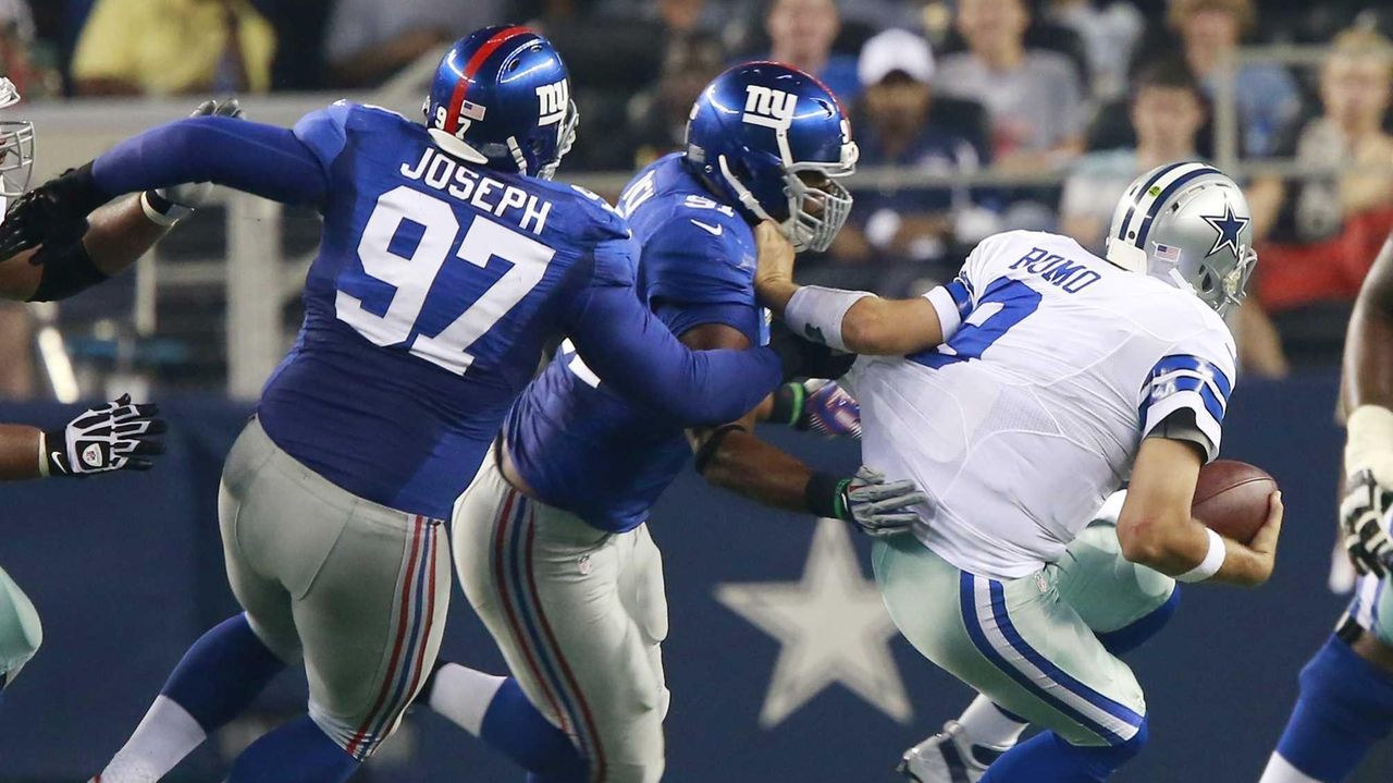 Photo: New York Giants Jason Piere-Paul and Justin Tuck (91) chase