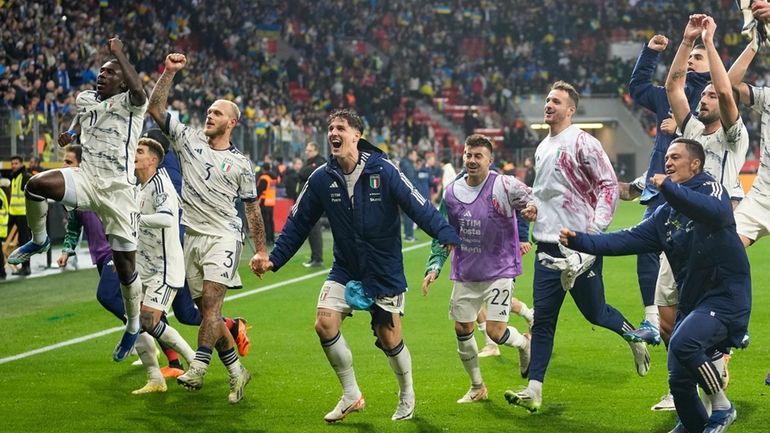 Italy players celebrate their qualifying after the Euro 2024 group...