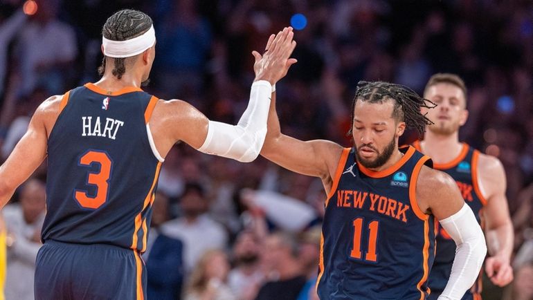 The Knicks' Jalen Brunson high-fives Josh Hart in the fourth quarter...