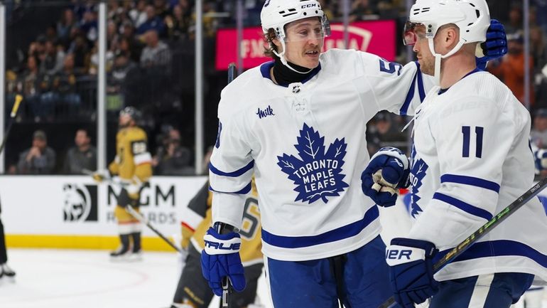 Toronto Maple Leafs left wing Tyler Bertuzzi (59) celebrates with...