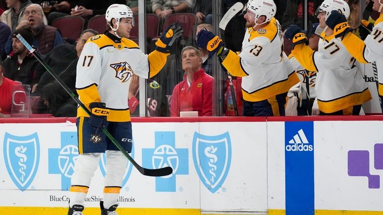 Nashville Predators center Mark Jankowski, left, celebrates his goal during...