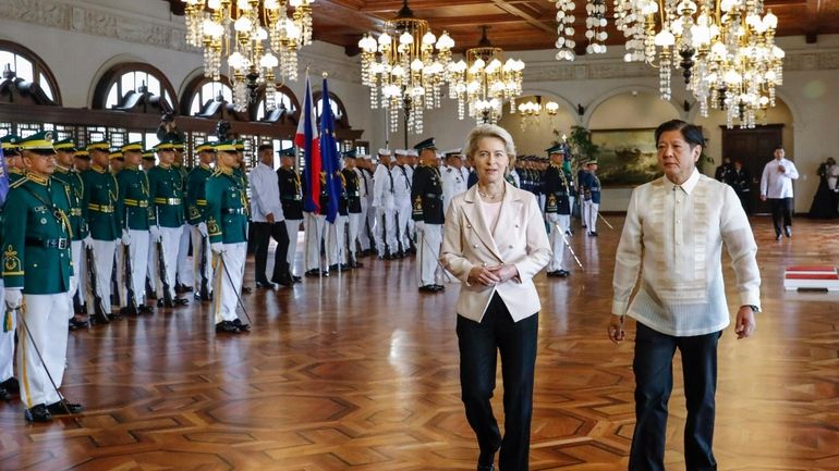 Philippine President Ferdinand Marcos Jr., right, walks with European Commission...